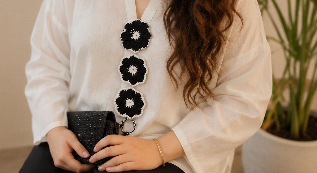 White Top with Black Floral Embellishment & Black Trousers